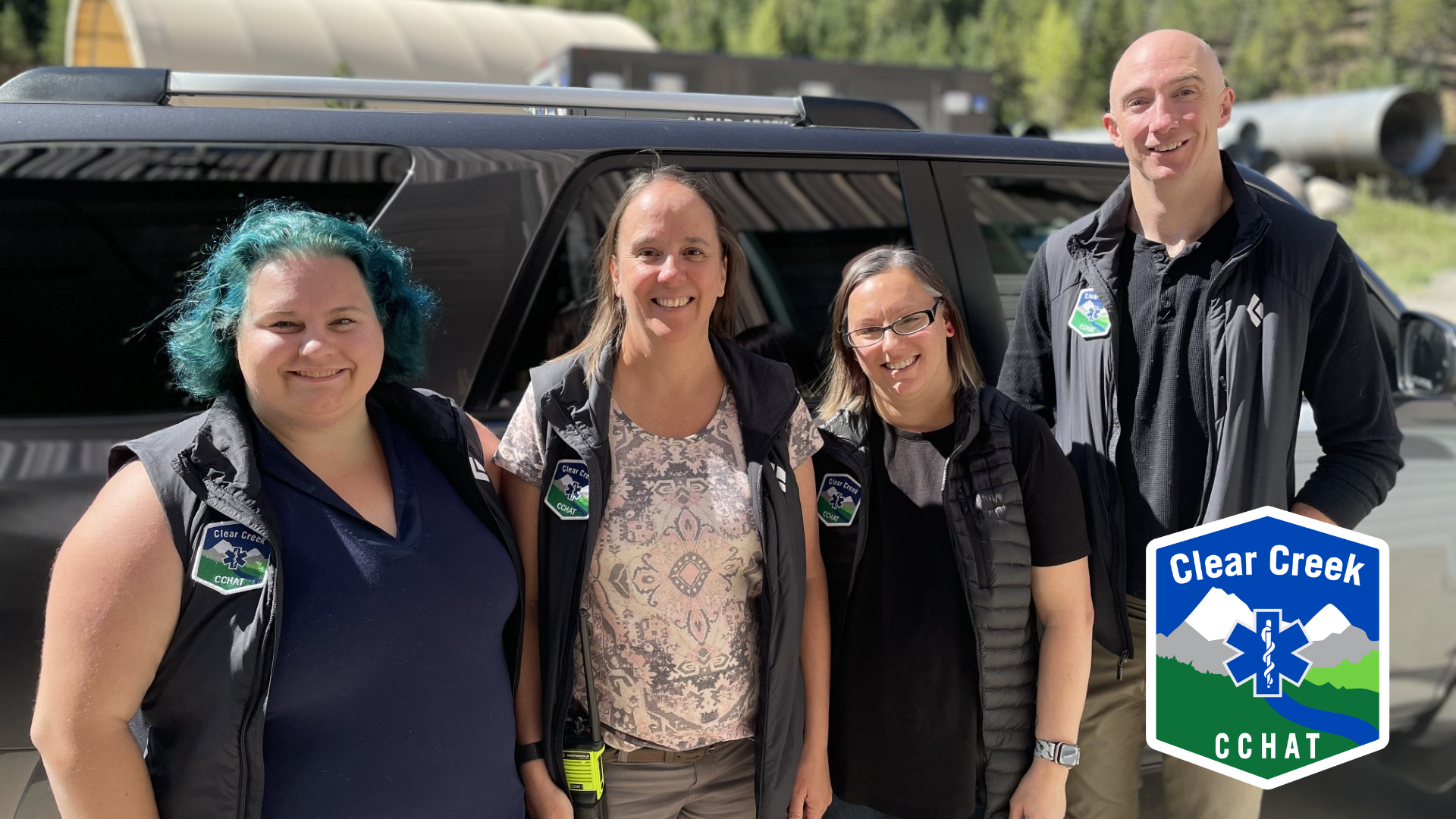 CCHAT Team with logo in the bottom right on a sunny day.